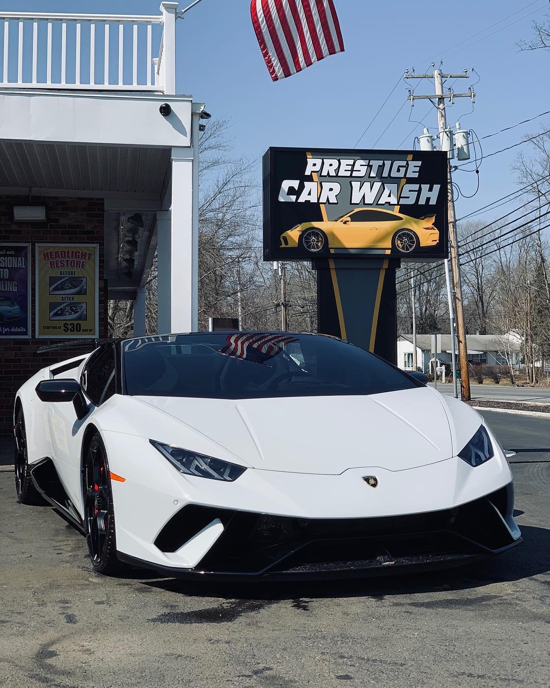 White Lamborghini Huracan in glossy XPEL Ultimate Plus paint protection film at Prestige Car Wash in Hopewell Junction NY