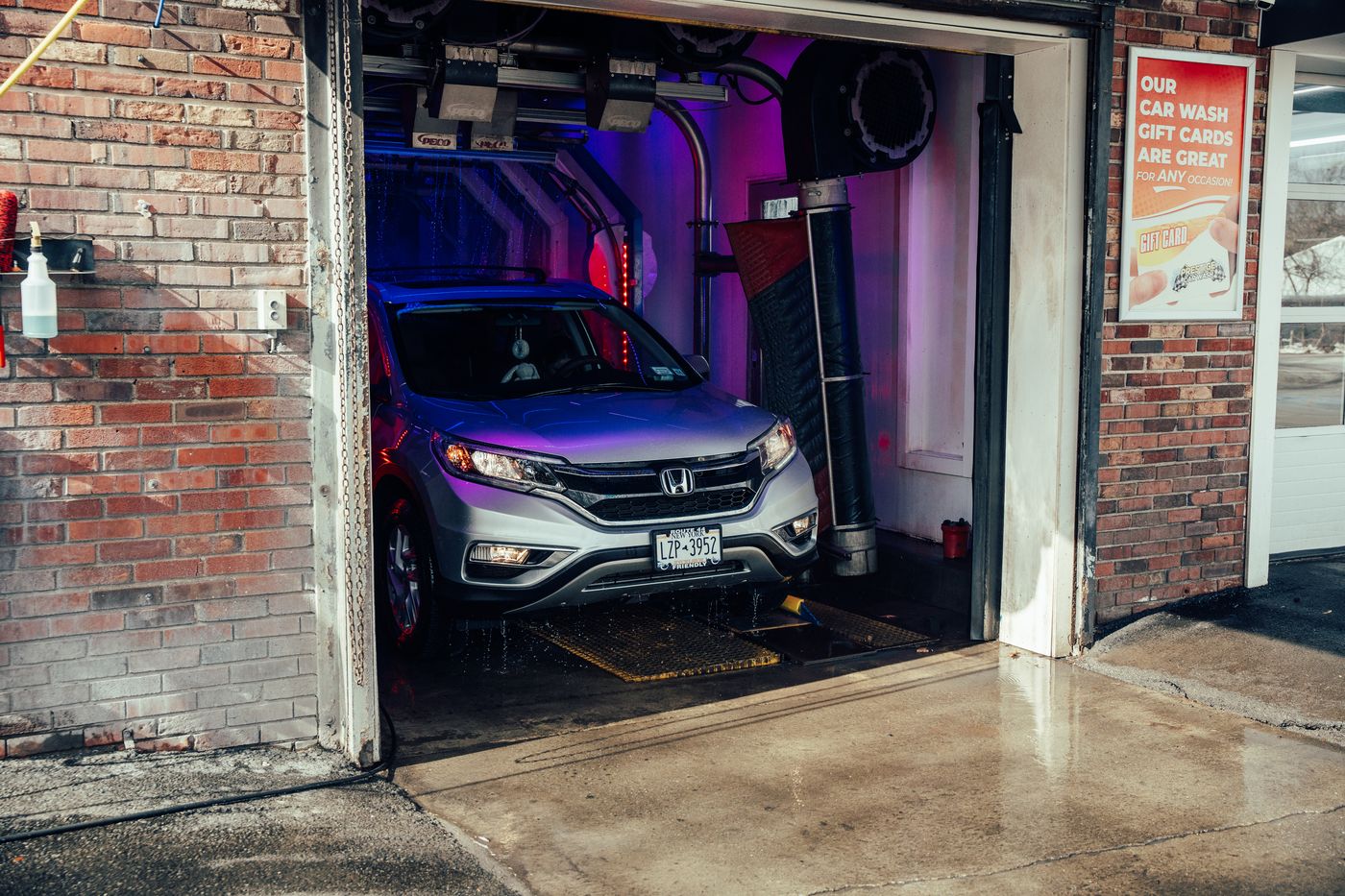 A car going through the Prestige soft-touch wash tunnel